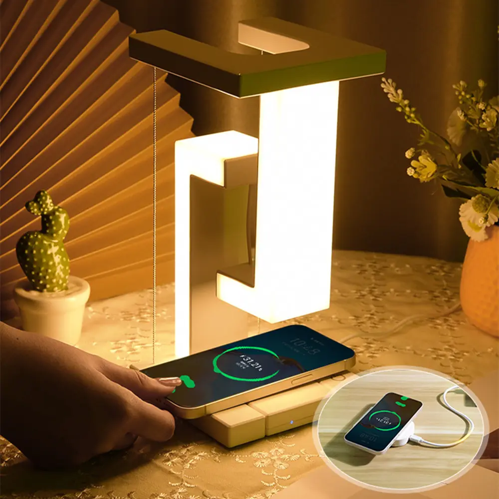 Table lamp with wireless charging pad on a wooden surface