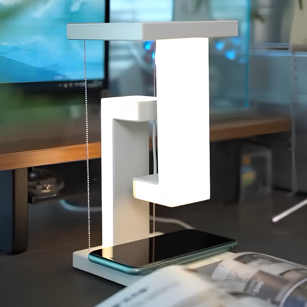 Modern desk lamp with smartphone stand on a blurred office background