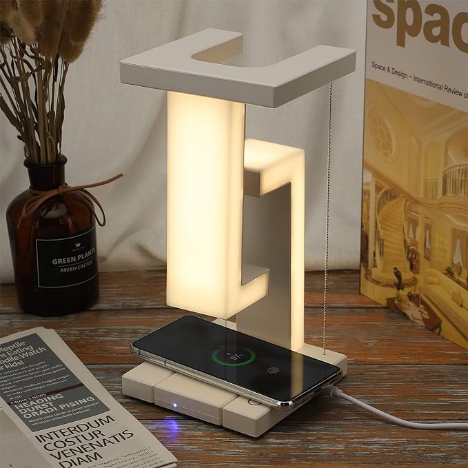 Modern lamp with wireless charging pad on a wooden surface
