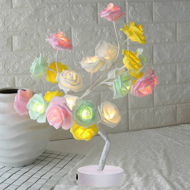 Decorative lamp with colorful flowers on a white brick wall background