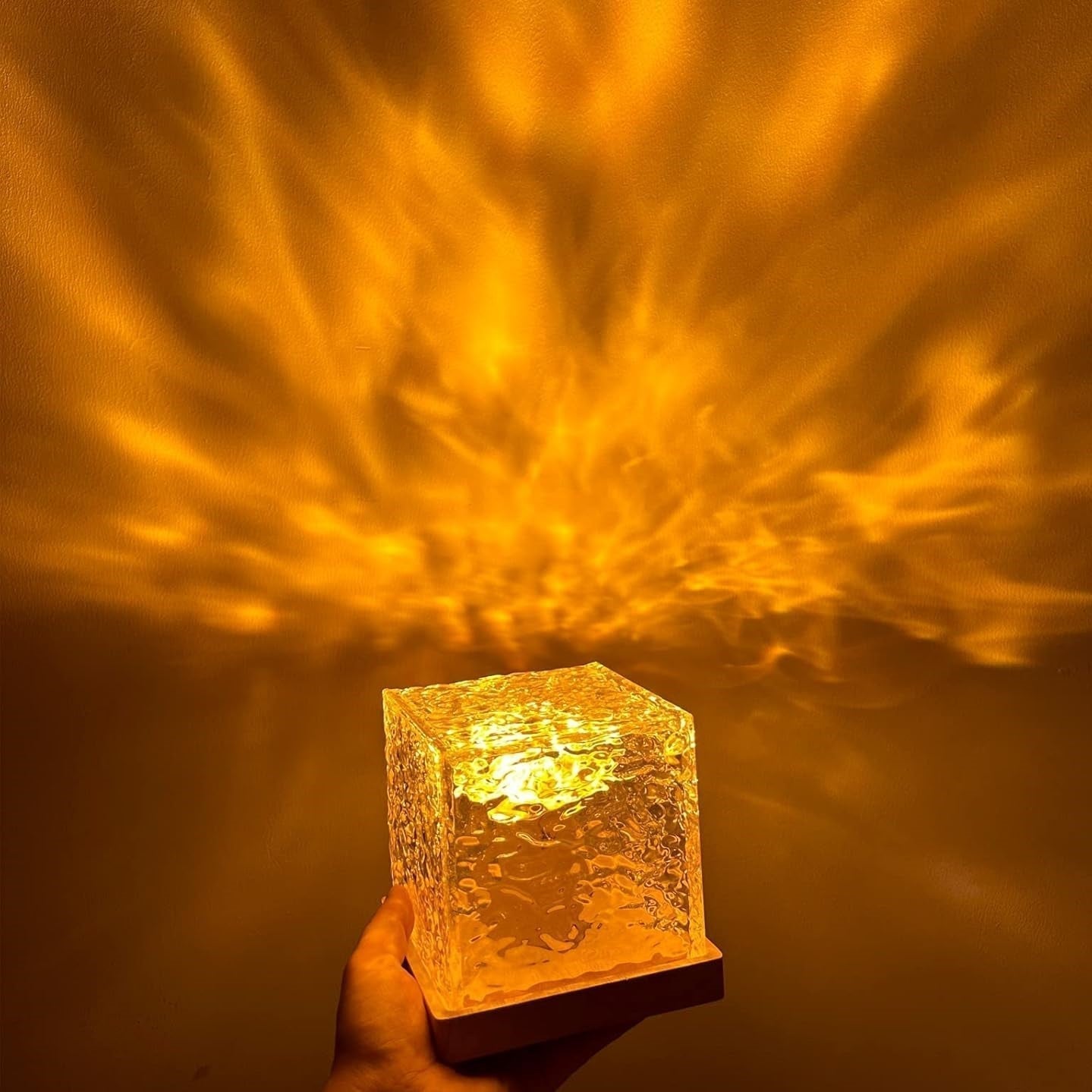 Glass block with a warm glow against a dark background