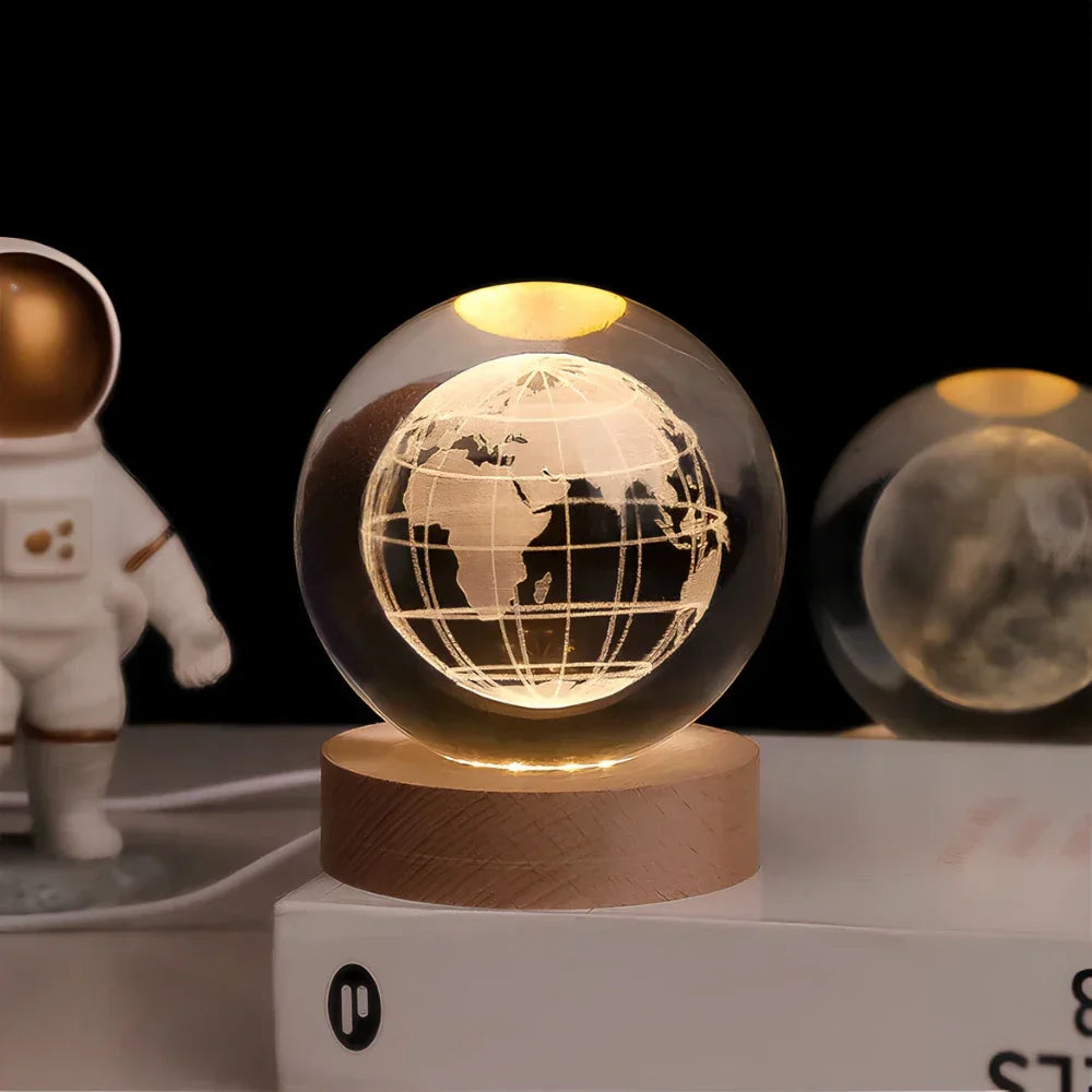 Lighted globe on a wooden base with an astronaut figure in the background