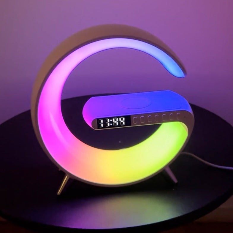 Colorful LED clock with digital display on a dark surface