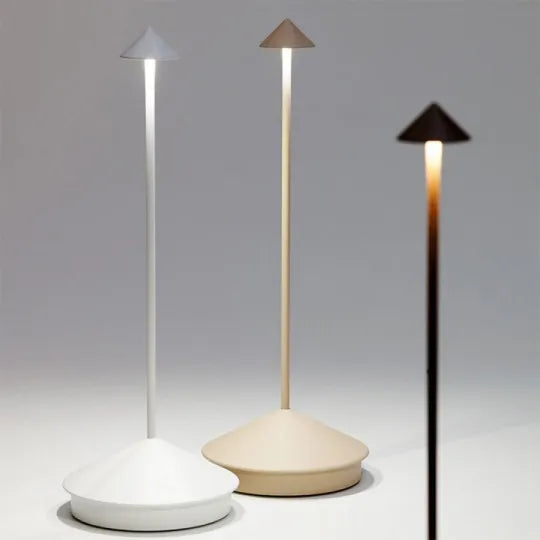 Three modern outdoor lamps with different shades of light on a gray background