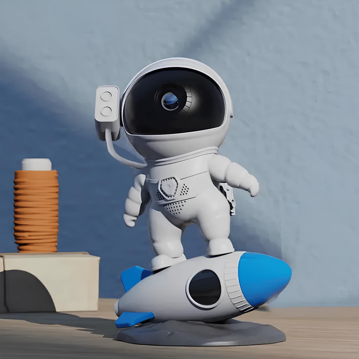 Toy robot on a rocket with a blue background