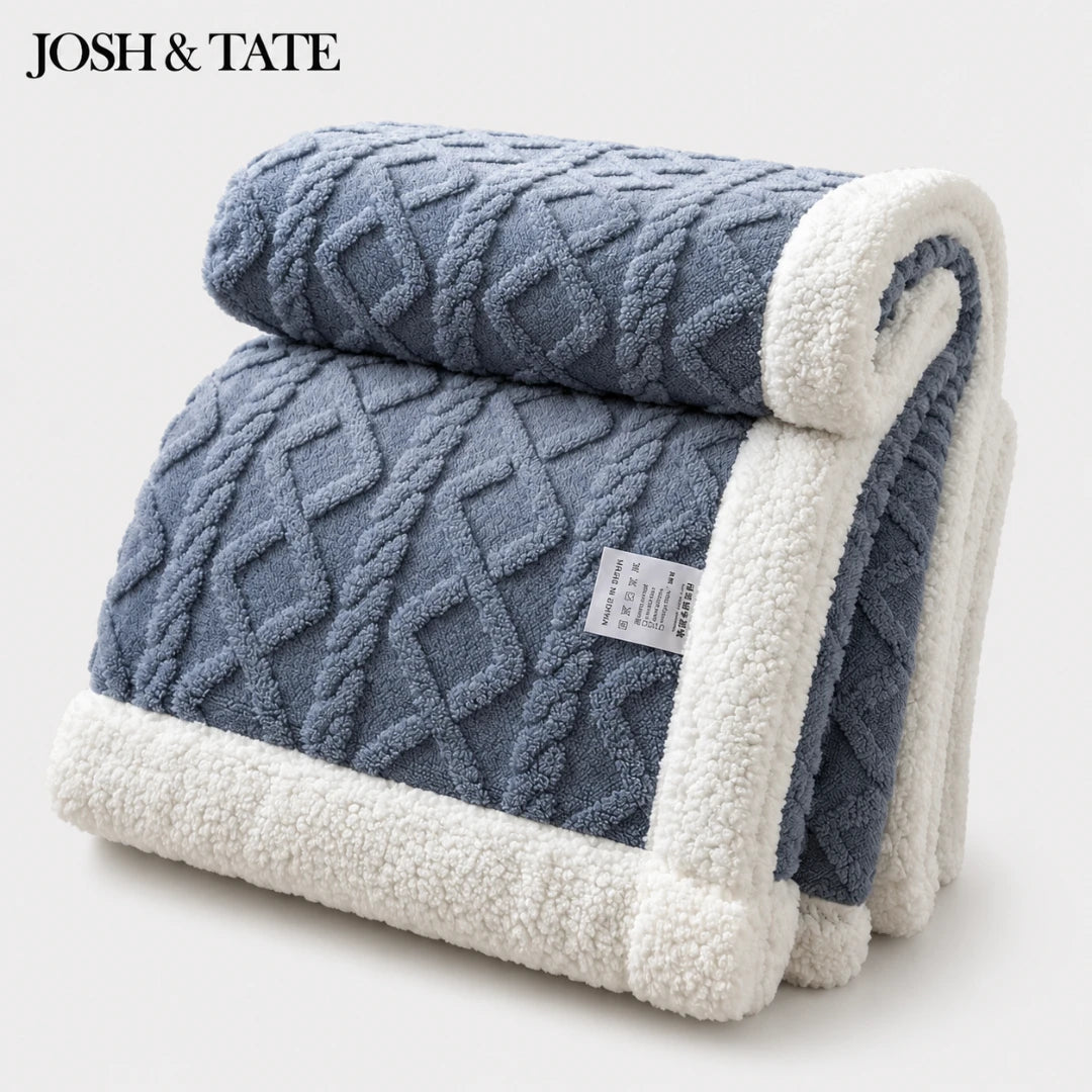 Josh & Tate - CoziKnit™ Reversible Sherpa Blanket - Blue textured blanket with white border and label on a light gray background, featuring the brand 'Josh & Tate'.