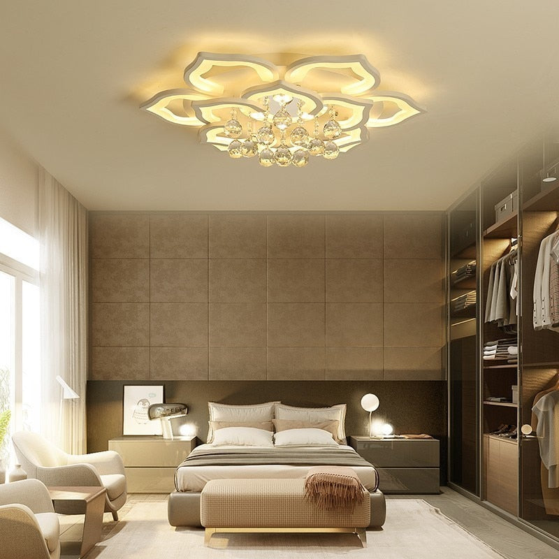 Modern bedroom with a decorative ceiling light fixture.