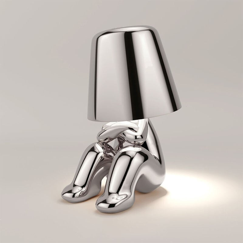 Chrome lamp with unique design on a light gray background