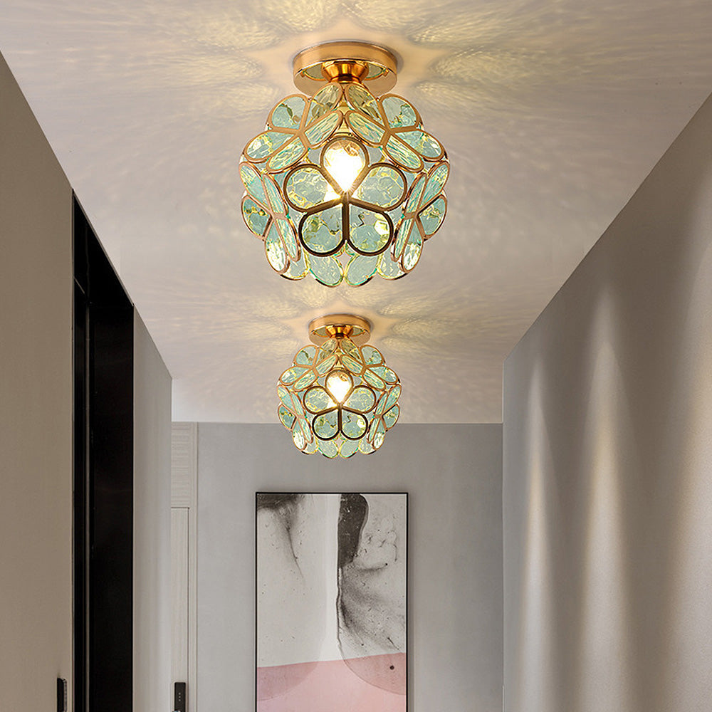 Decorative ceiling lights with floral design in a room setting.