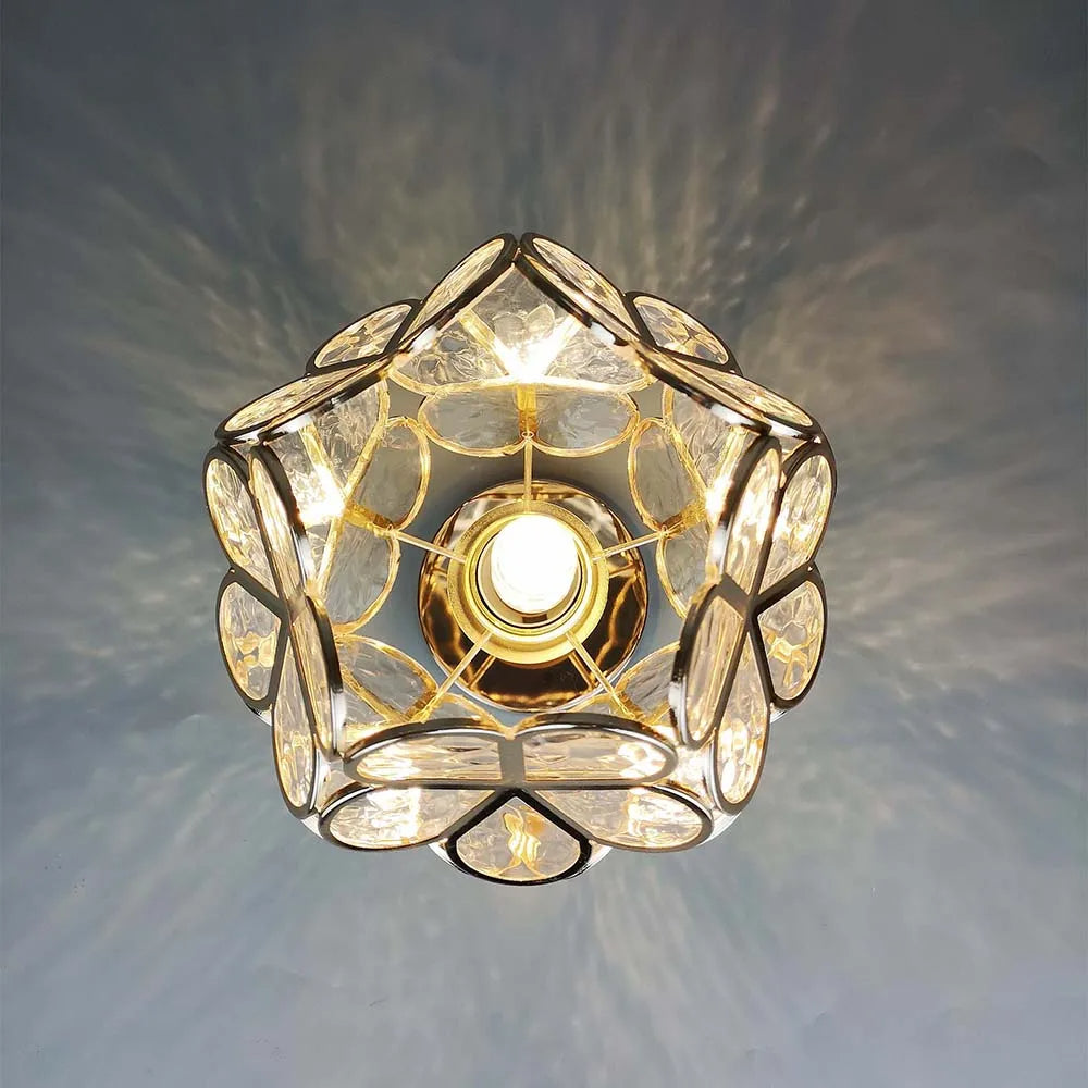 Decorative ceiling light fixture with crystal-like design on a gray background