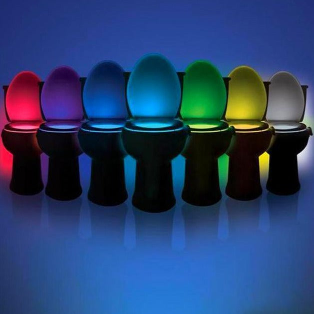 Row of toilet bowls with colorful illuminated lids on a blue background