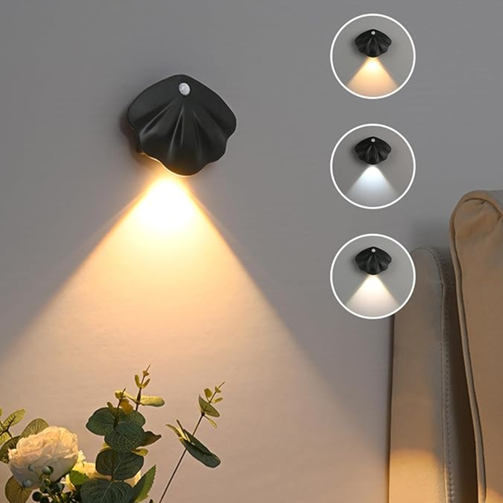 Black wall-mounted light fixture with different light settings on a gray wall.