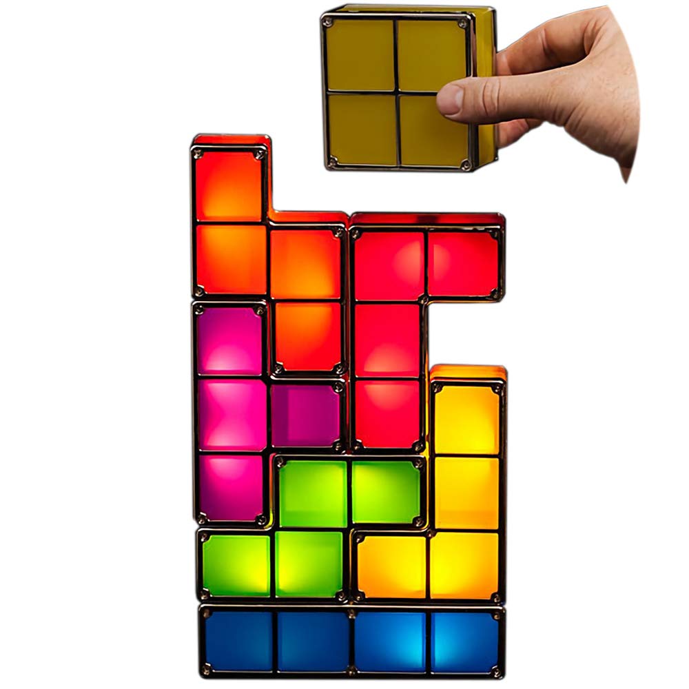 Colorful Tetris-style light blocks being held by a hand on a white background