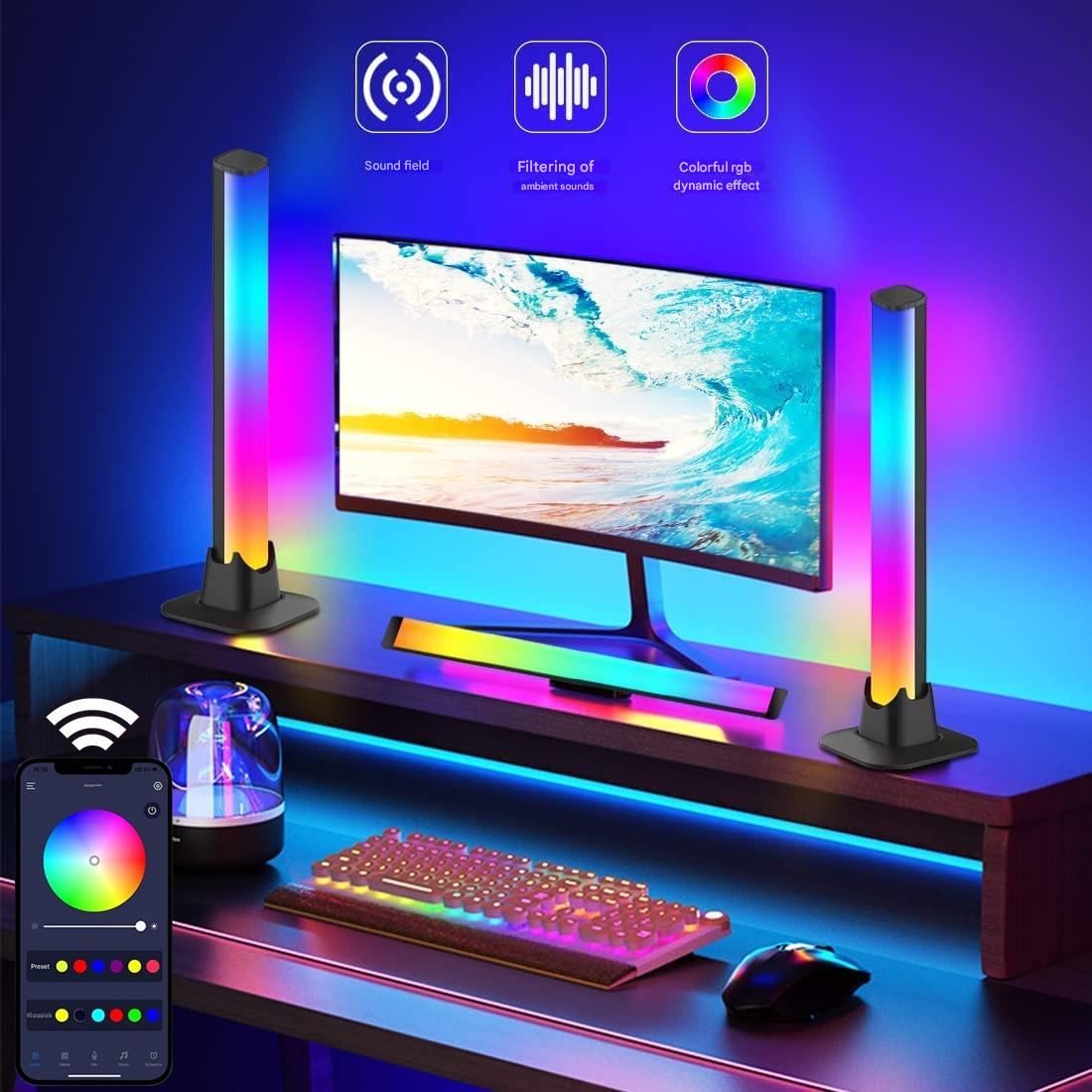 Gaming setup with RGB lighting, monitor, keyboard, and mouse on a desk.