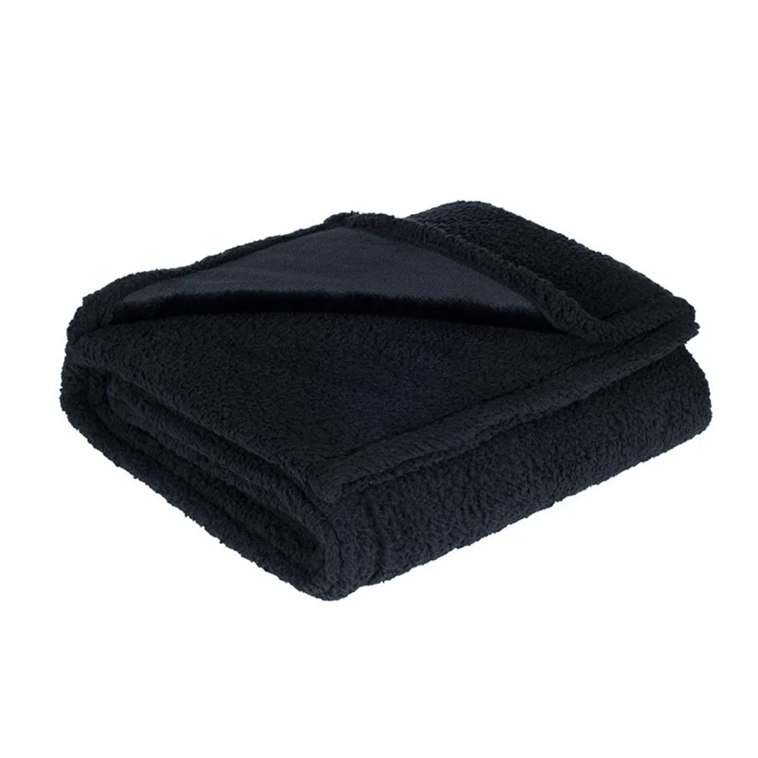 Folded black blanket on a white background