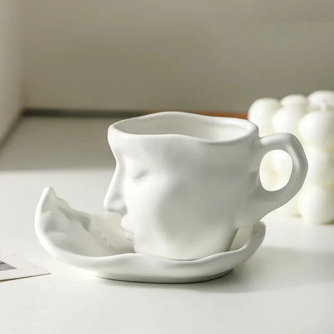 Josh & Tate - Lover's Gaze Reverie Coffee Ceramic Mug - White ceramic face-shaped mug and saucer on a light surface