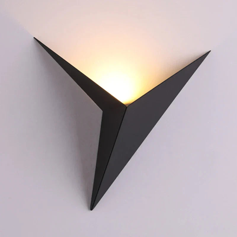 Triangular wall light fixture on a white background