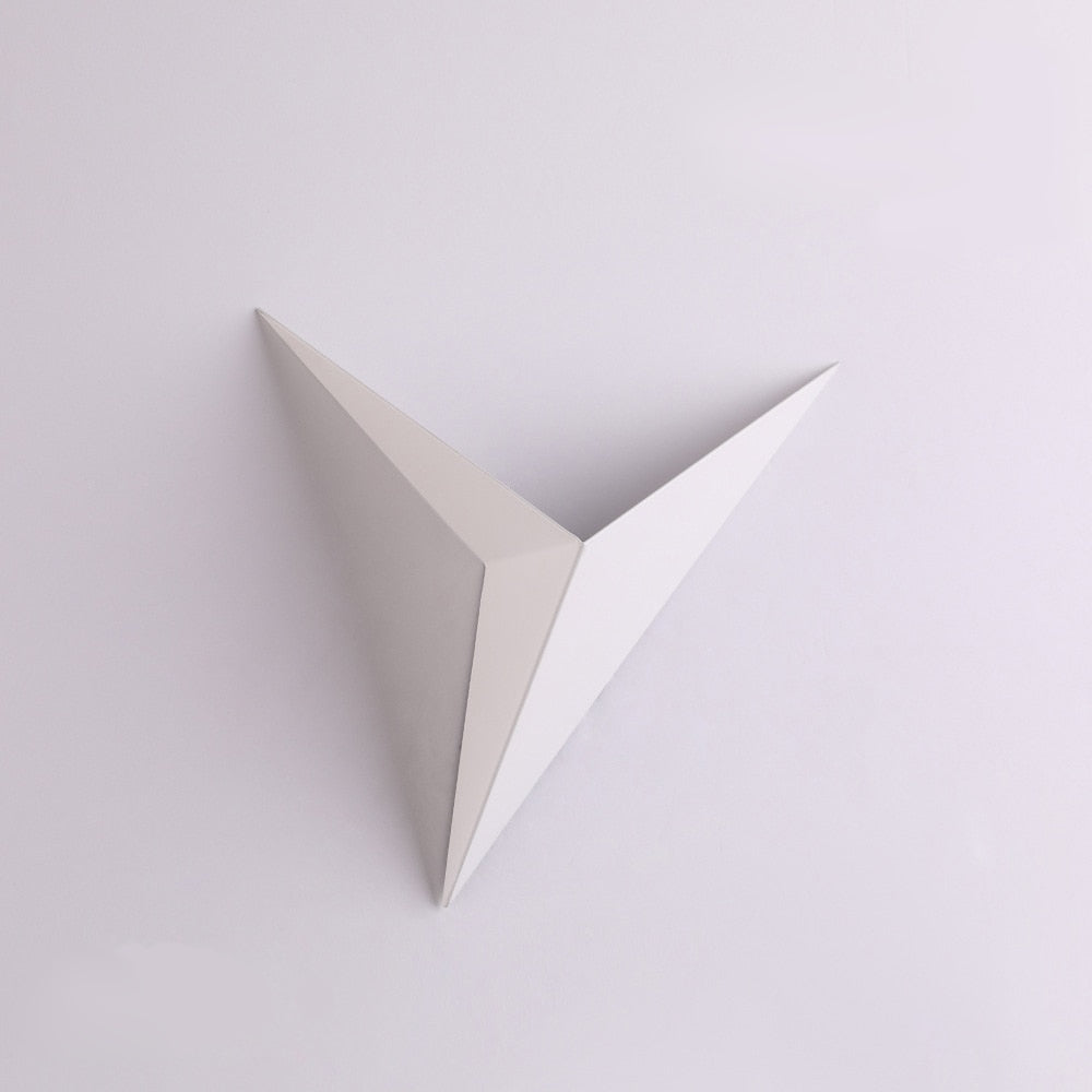 White triangular object on a light gray background