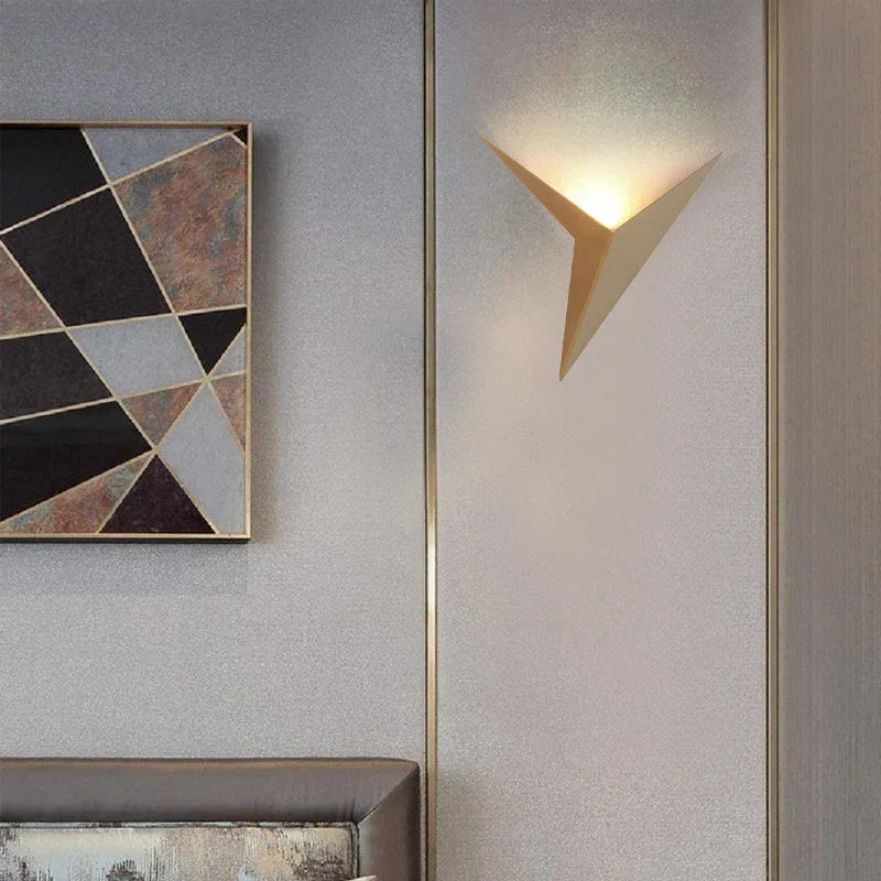Modern wall lamp and abstract art on a textured wall