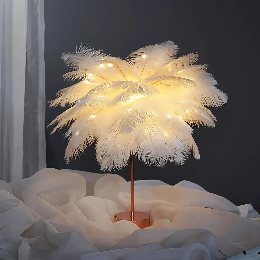 Decorative feather lamp with string lights on a dark background
