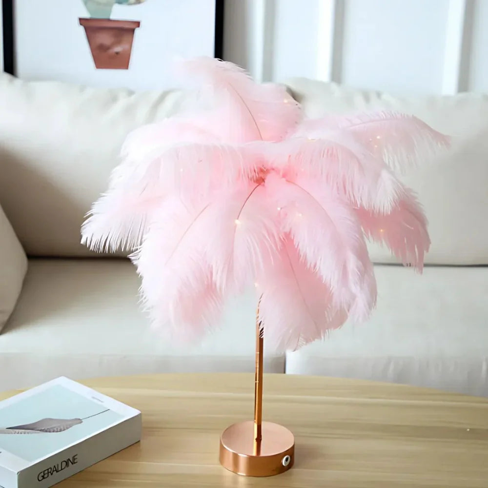 Pink feathered lamp on a wooden table with a blurred background