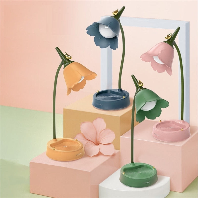 Flower-shaped lamps on colorful geometric blocks with a pastel background