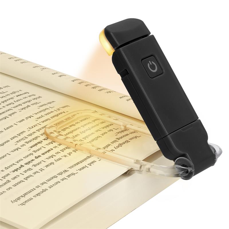 Reading lamp with clip on an open book