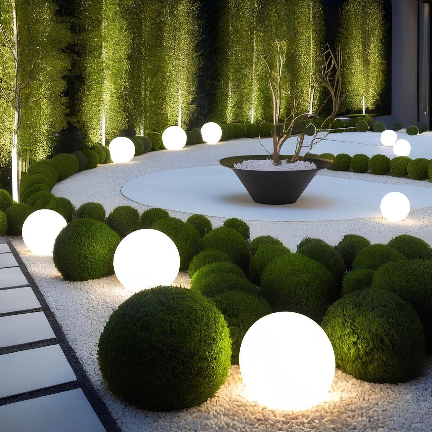 Garden with spherical green plants and illuminated white spheres, featuring a modern building.