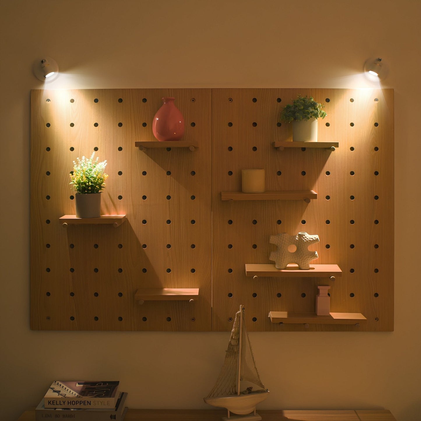 Wooden pegboard wall with shelves holding decorative items under warm lighting.