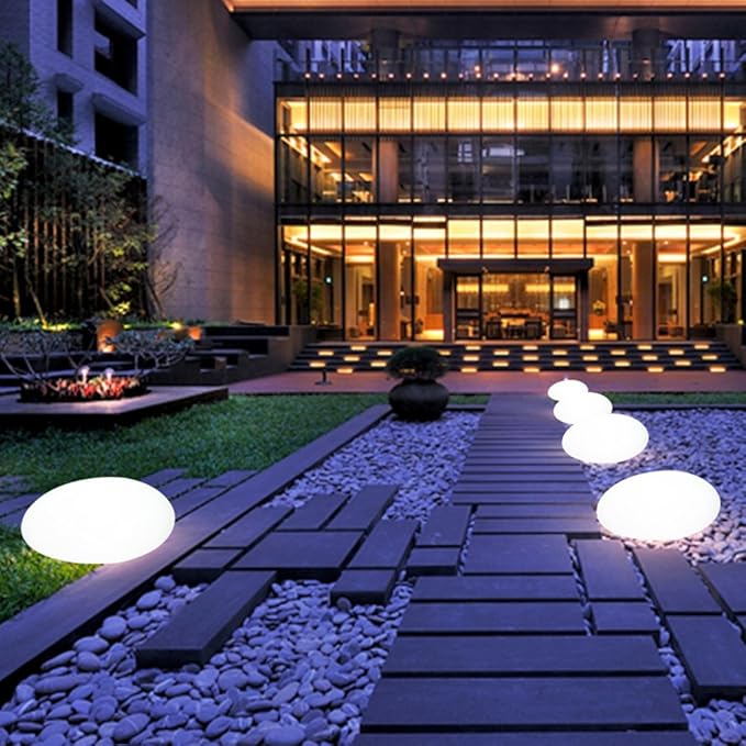 Modern building exterior with illuminated pathway and decorative lights