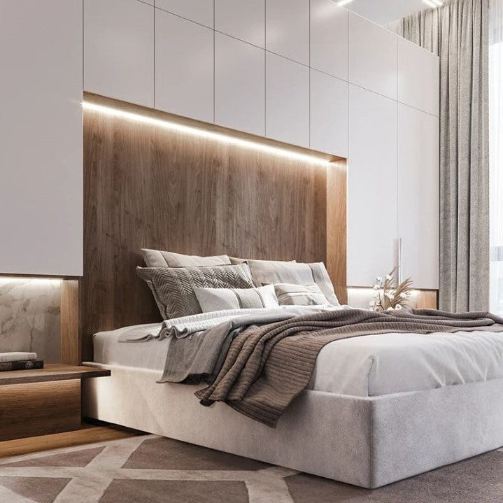 Modern bedroom with wooden headboard and neutral color scheme