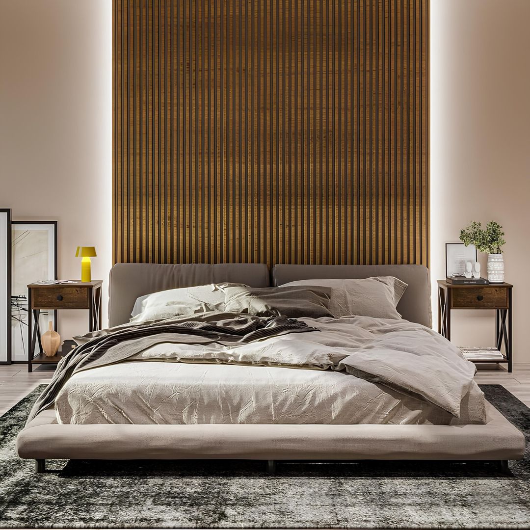 Modern bedroom with a large bed against a textured wall.