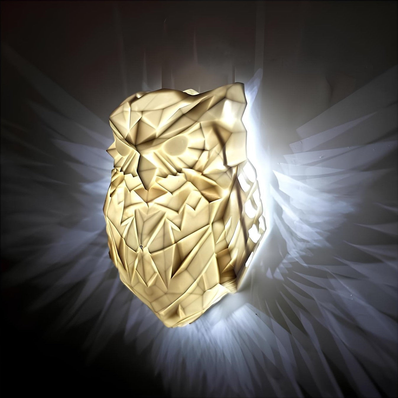 Gold owl-shaped object with a dark background