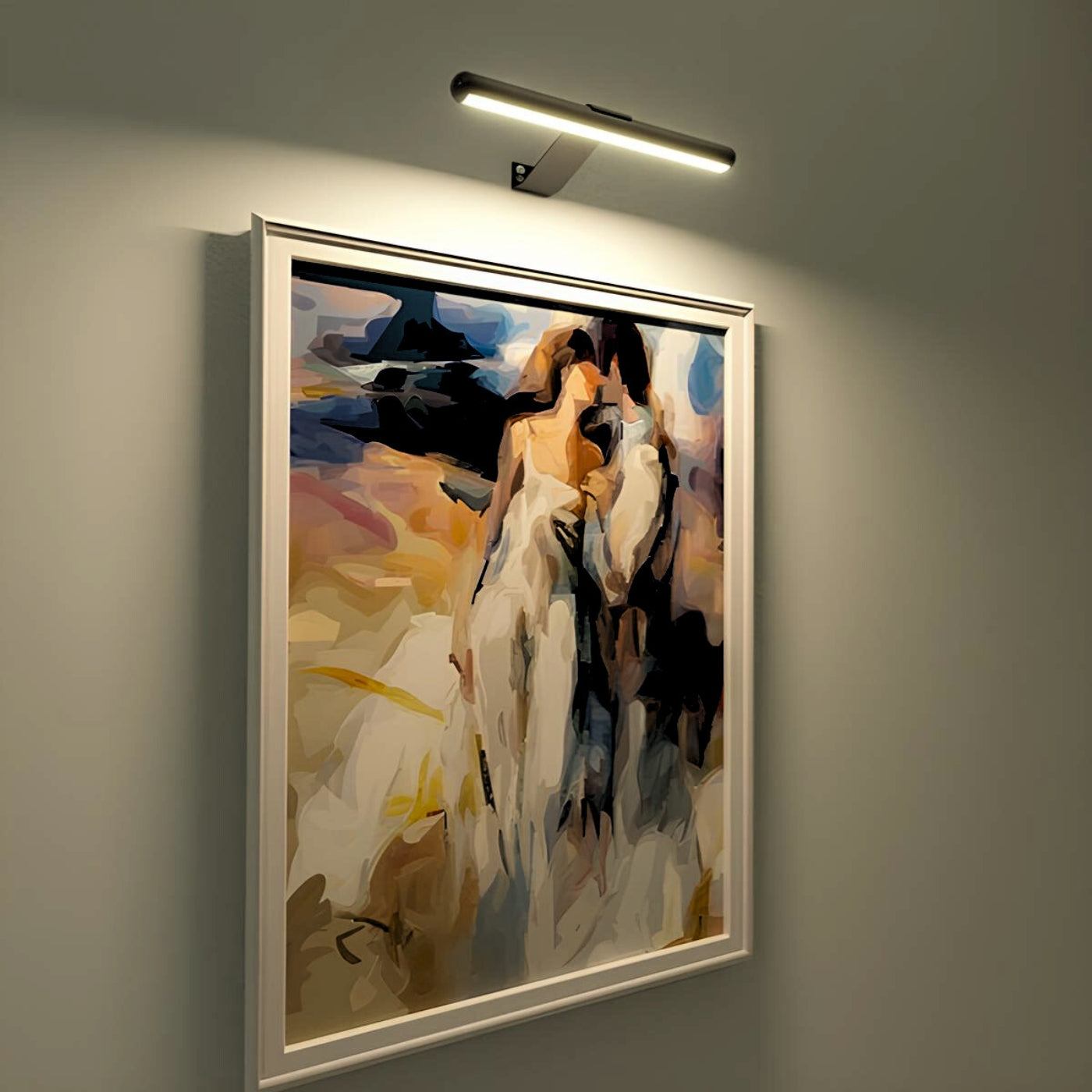 Framed abstract painting on a wall with a light fixture above