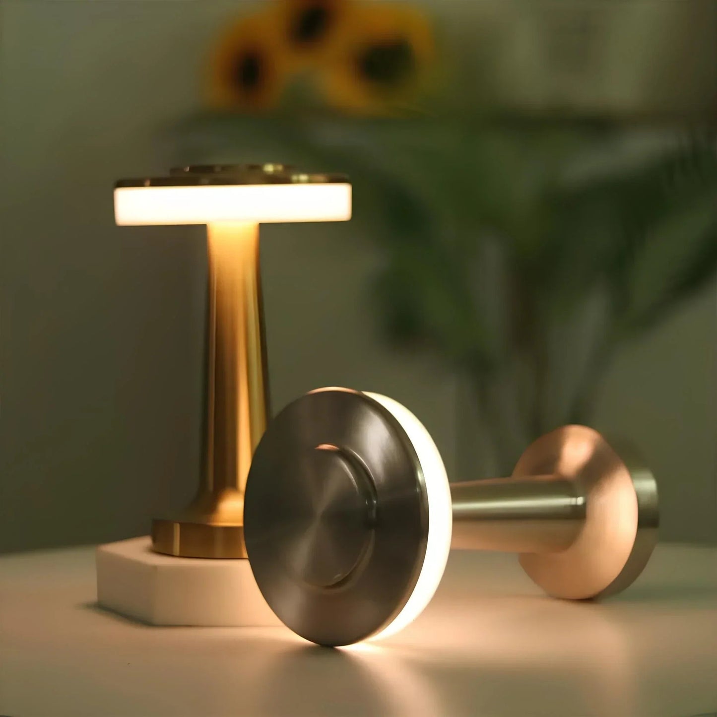 Decorative lamp with a metallic finish on a surface with a blurred background