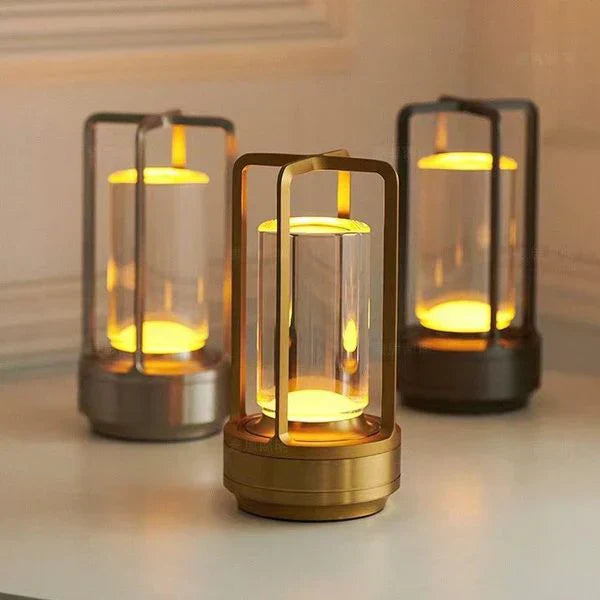 Three decorative lamps with glass shades on a neutral background
