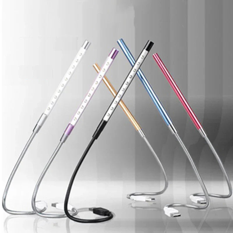 Set of colorful LED light sticks on a reflective surface with a gradient background