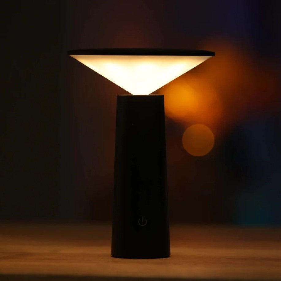 Black lamp with a triangular shade on a dark background