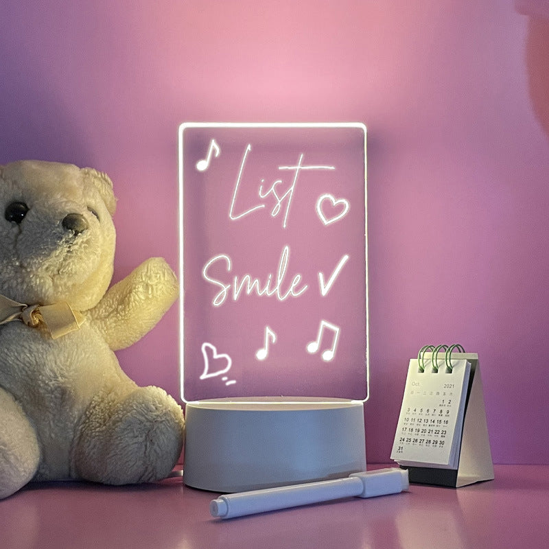 Neon sign with 'List Love Smile' text, teddy bear, and calendar on a pink background
