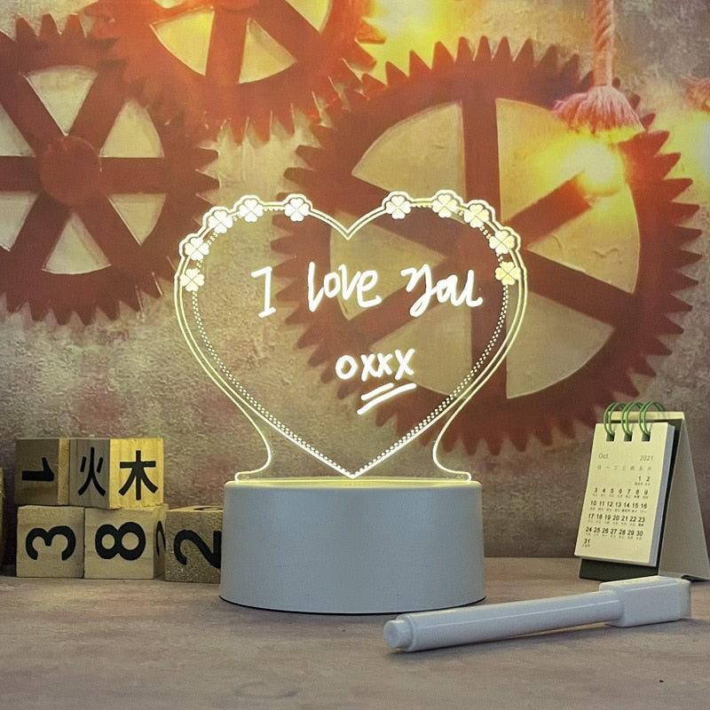 Heart-shaped night light with 'I love you' text in front of mechanical gear background