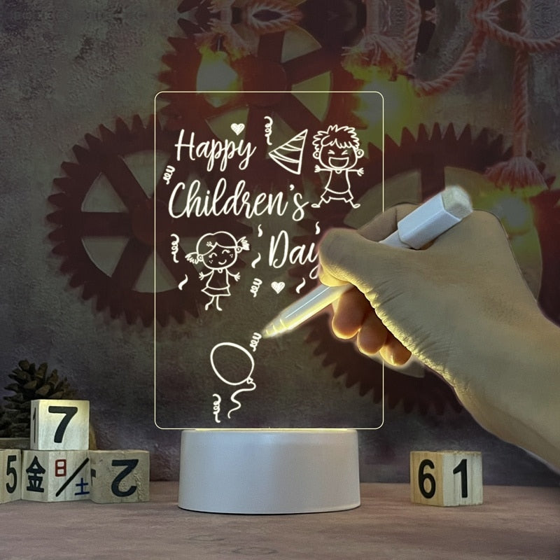 Children's Day-themed light-up board with hand holding a pen, surrounded by decorative elements.