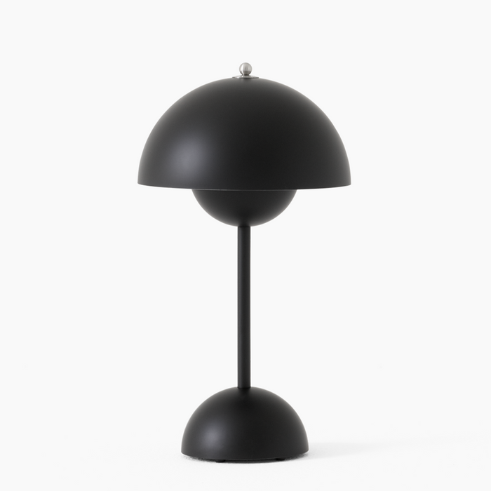 Black table lamp with a unique design on a white background