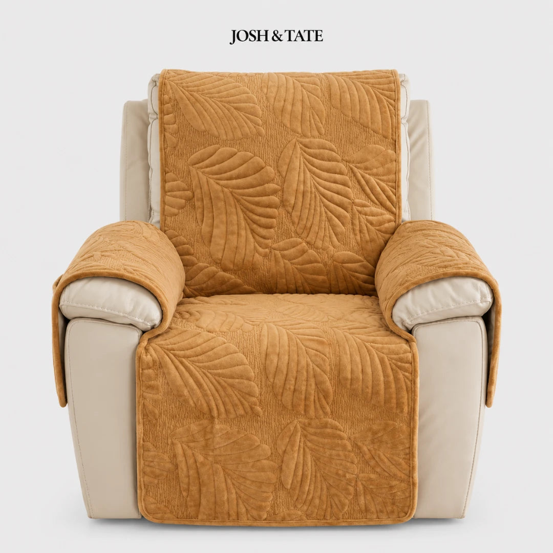 Josh & Tate - PalmSoft™ Quilted Chair Cover - Brown leaf-patterned chair cover on a beige armchair with 'Josh & Tate' branding.