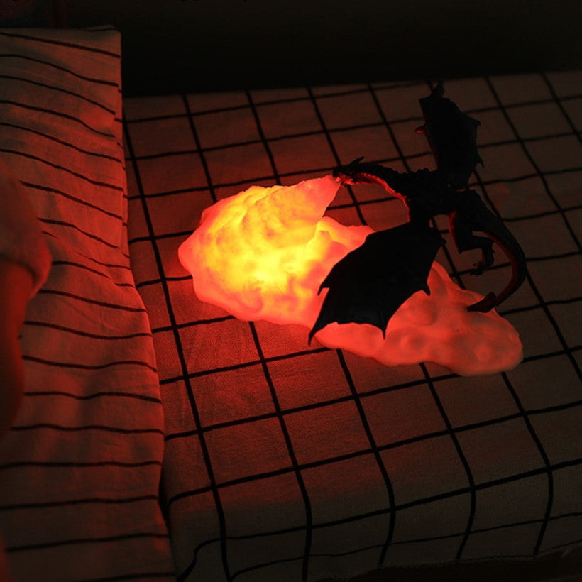 Toy dragon with glowing red chest on a grid surface