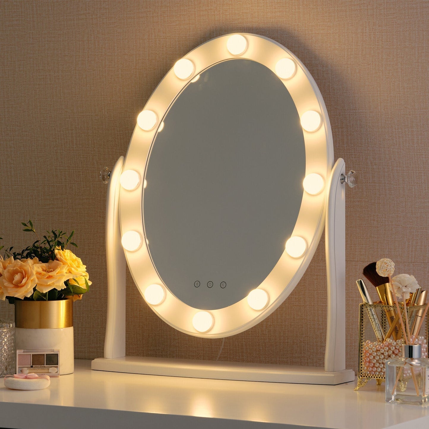 Lighted vanity mirror on a desk with decorative items