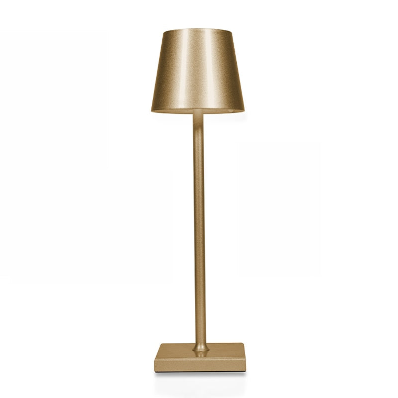 Gold table lamp on a white background