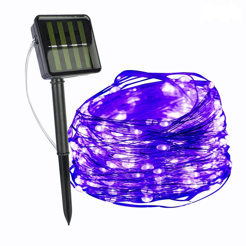 Purple string lights with solar panel and stake on a white background