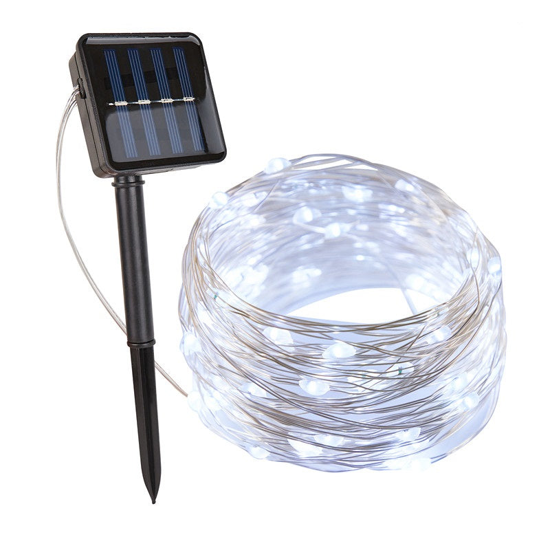 Solar-powered string lights with solar panel and stake on a white background