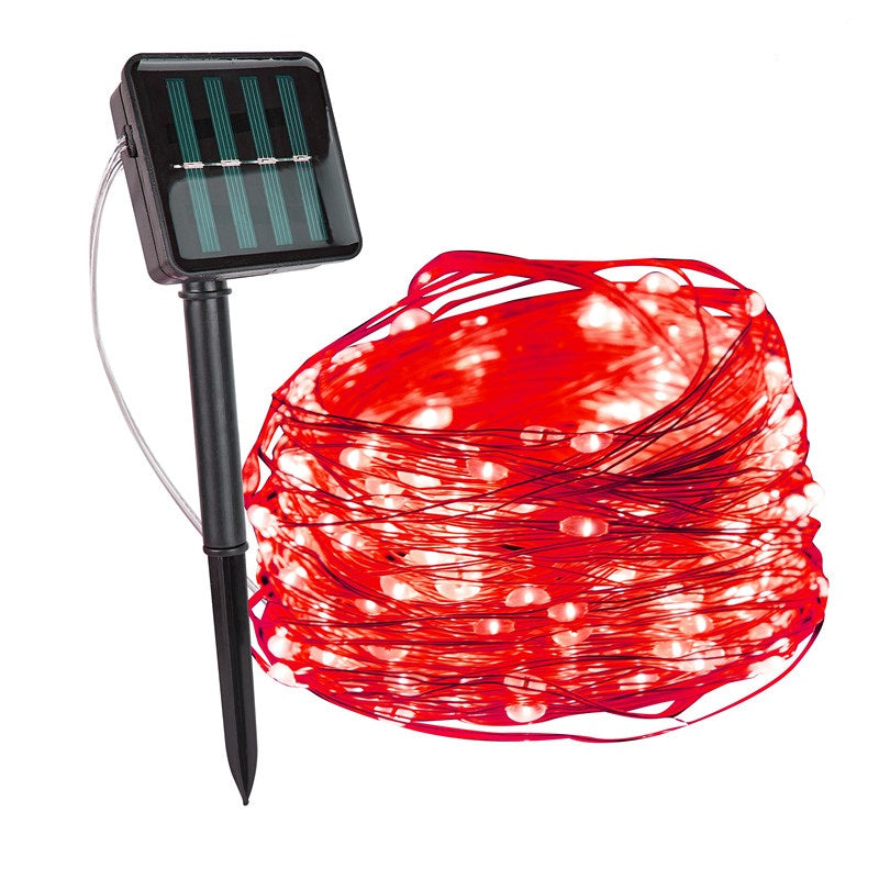 Red string lights with solar panel and stake on a white background