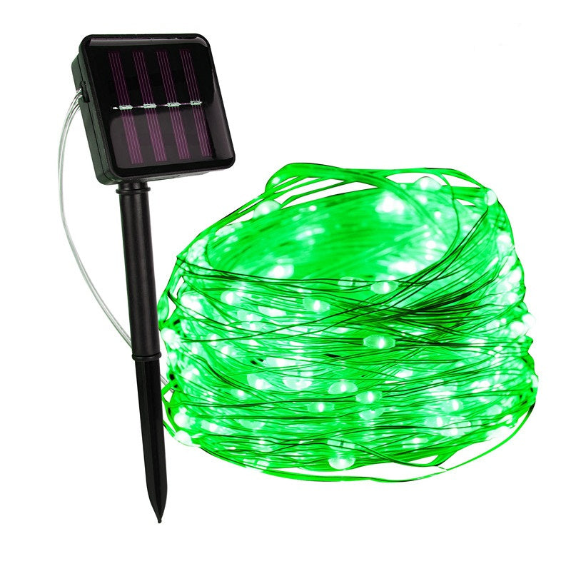 Green string lights with solar panel and stake on a white background